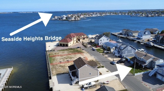 bird's eye view featuring a residential view and a water view