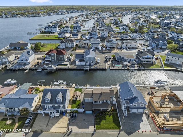 aerial view with a water view and a residential view