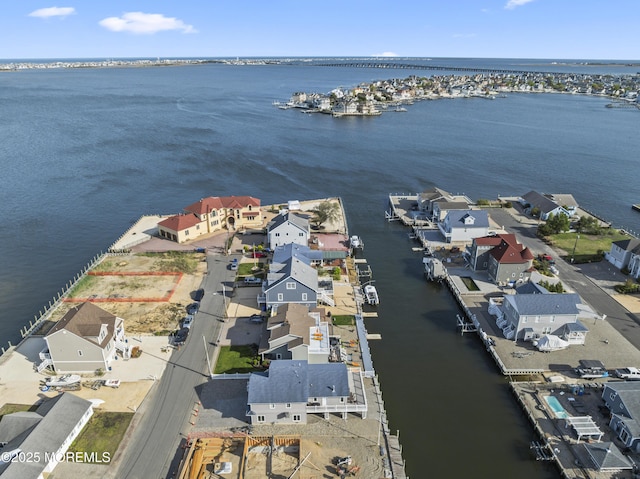bird's eye view featuring a residential view and a water view