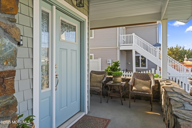 entrance to property featuring covered porch