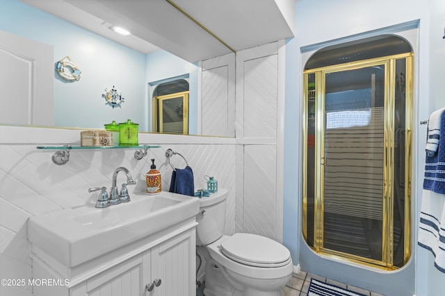 full bath with vanity, tile patterned floors, a stall shower, and toilet