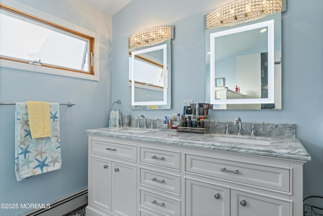 full bathroom featuring a sink, a baseboard radiator, and double vanity