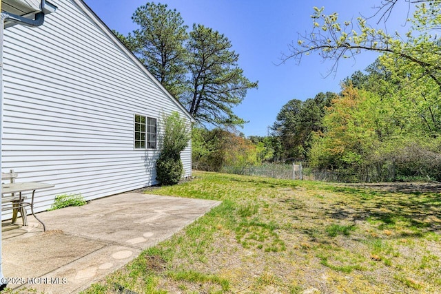 view of yard with a patio and fence