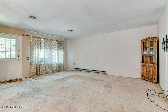 interior space with visible vents, a baseboard radiator, and cooling unit