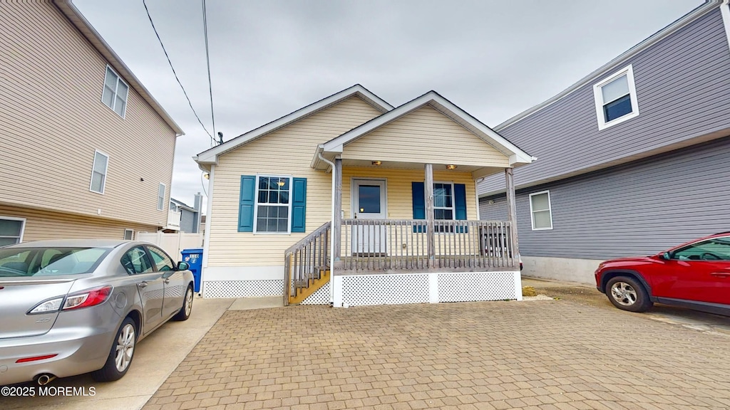 110 6th Ave, Ortley Beach, NJ 08751 - bungalow-style house featuring a porch