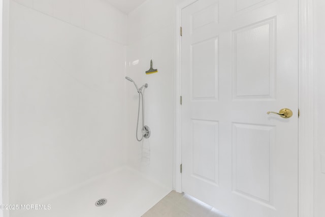 bathroom featuring a shower and tile patterned floors