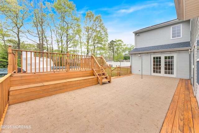 wooden terrace featuring fence