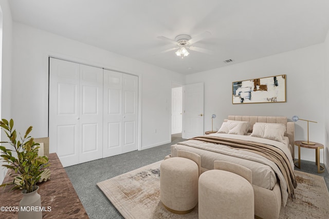 bedroom featuring a closet, visible vents, carpet floors, a ceiling fan, and baseboards