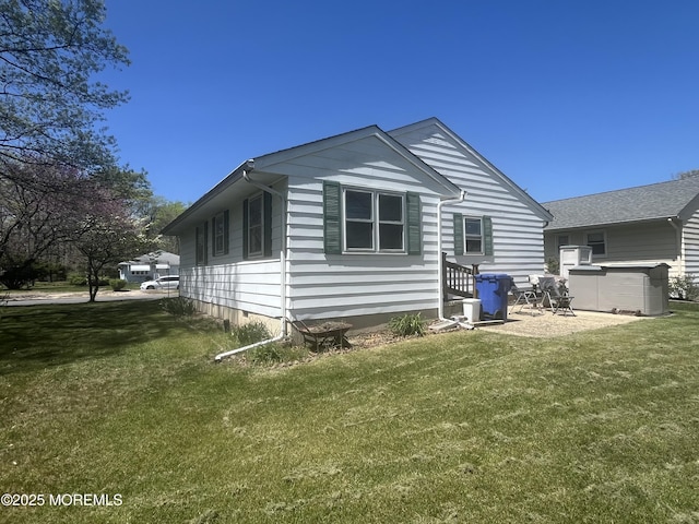rear view of house with a lawn