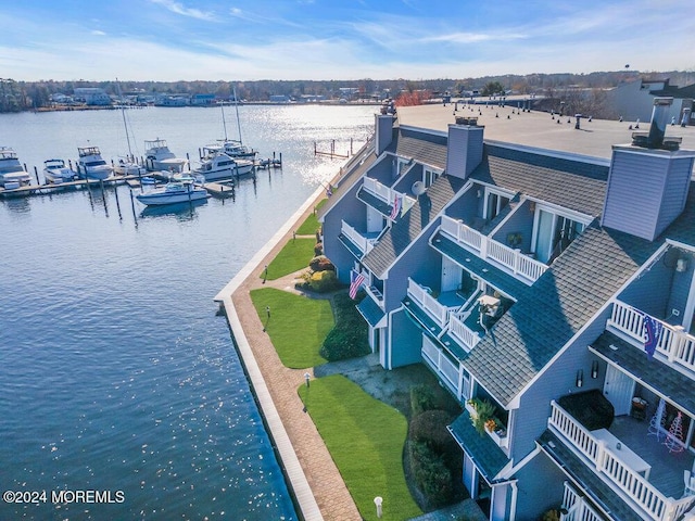 drone / aerial view with a water view