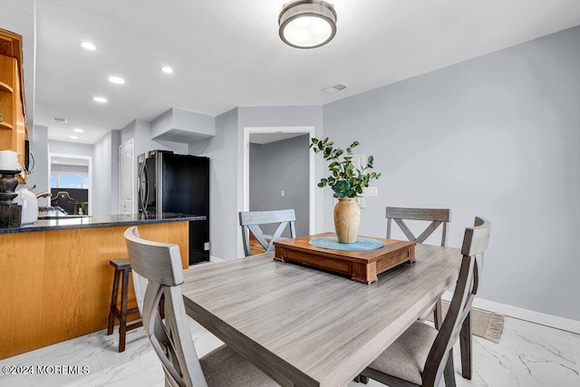 dining room with baseboards, visible vents, recessed lighting, and marble finish floor