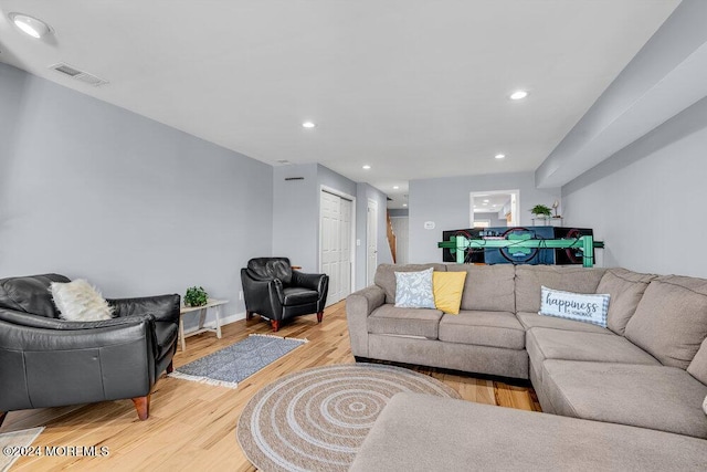 living area with visible vents, recessed lighting, and light wood finished floors