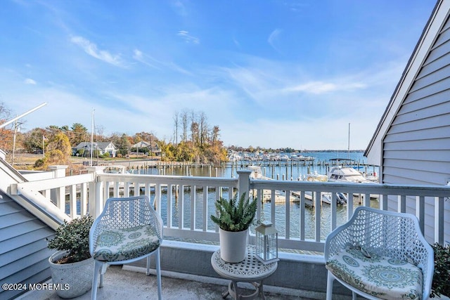 balcony featuring a water view