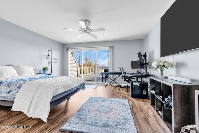 bedroom featuring access to outside, ceiling fan, and wood finished floors