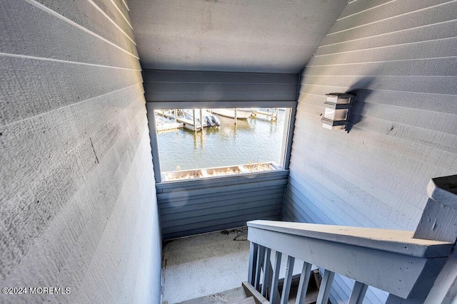 staircase with a water view