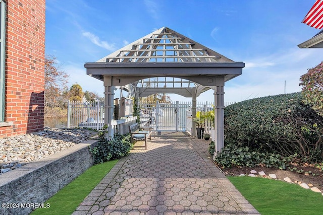 view of community with fence and a gazebo