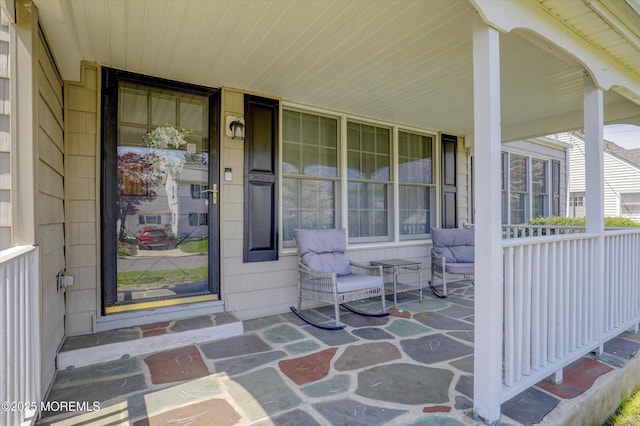 doorway to property with a porch
