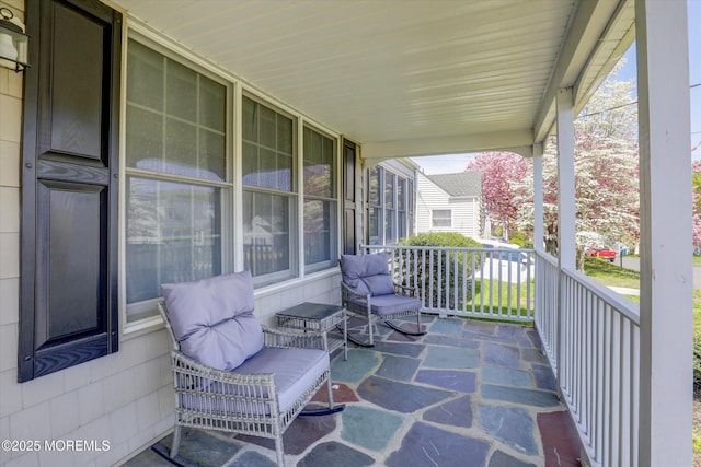 view of patio featuring a porch