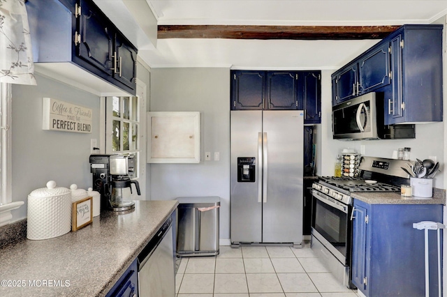 kitchen with light tile patterned floors, stainless steel appliances, and blue cabinets
