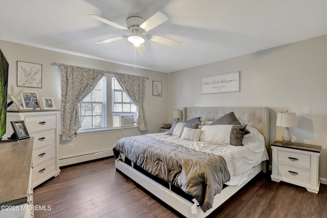bedroom with ceiling fan, cooling unit, a baseboard heating unit, and dark wood-type flooring