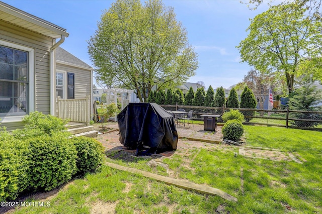 view of yard featuring fence and a patio