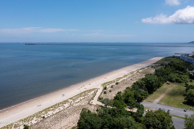 bird's eye view with a water view and a beach view