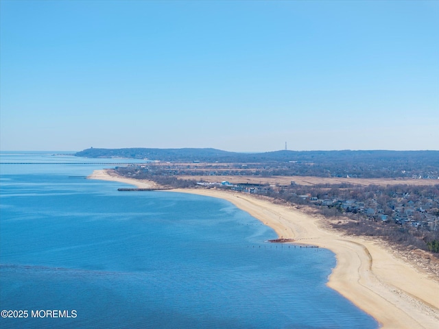 aerial view with a beach view and a water view
