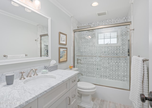 26 Bridge, Bay Head, NJ 08742 - full bathroom featuring vanity, shower / bath combination with glass door, toilet, ornamental molding, and wood finished floors