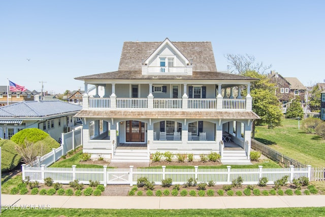 26 Bridge, Bay Head, NJ 08742 - view of front of home with a balcony, a porch, a fenced front yard, and a gate
