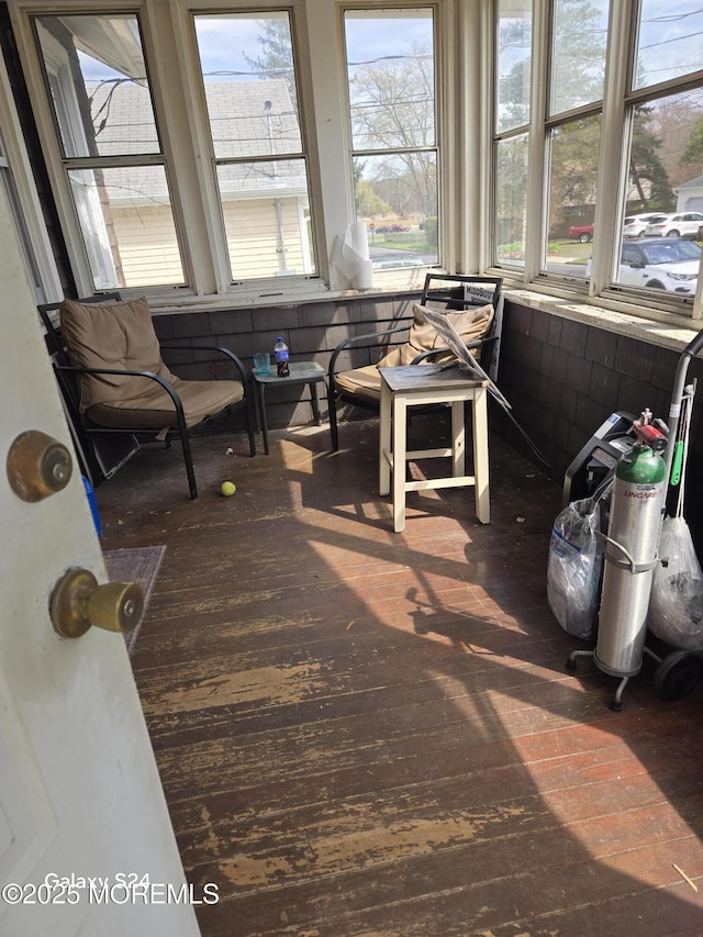 sunroom / solarium featuring a healthy amount of sunlight
