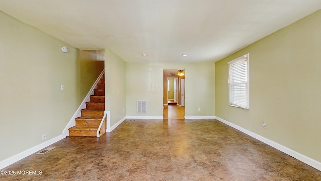 unfurnished living room featuring visible vents, recessed lighting, stairs, and baseboards