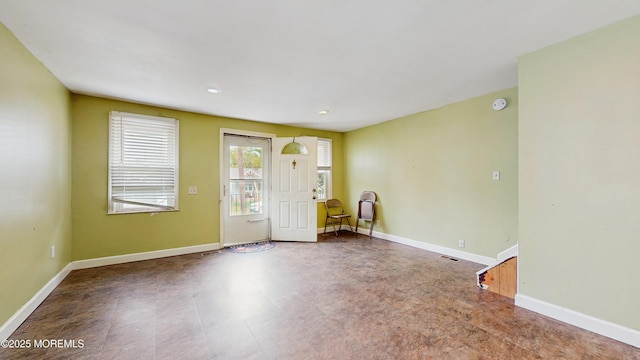 foyer with baseboards, recessed lighting, and visible vents