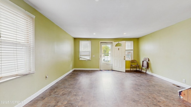 interior space with visible vents, recessed lighting, and baseboards