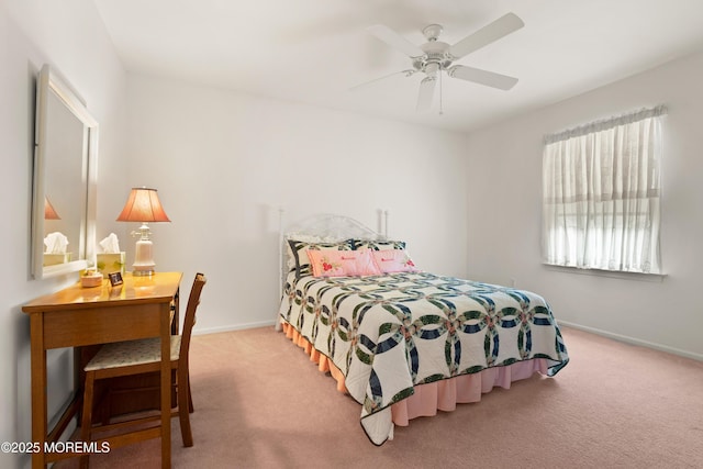 bedroom with carpet flooring, baseboards, and a ceiling fan