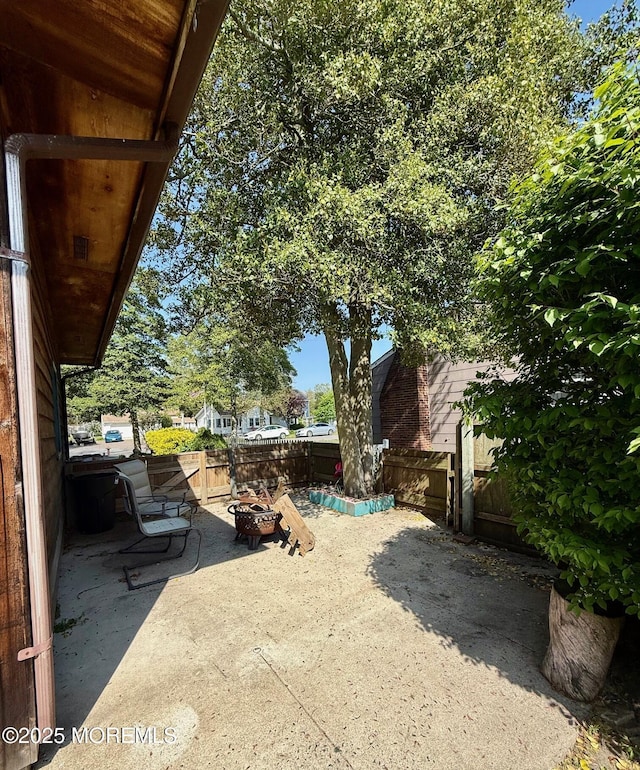 82 Bonita Rd, Waretown, NJ 08758 - view of patio / terrace featuring a fenced backyard and an outdoor fire pit