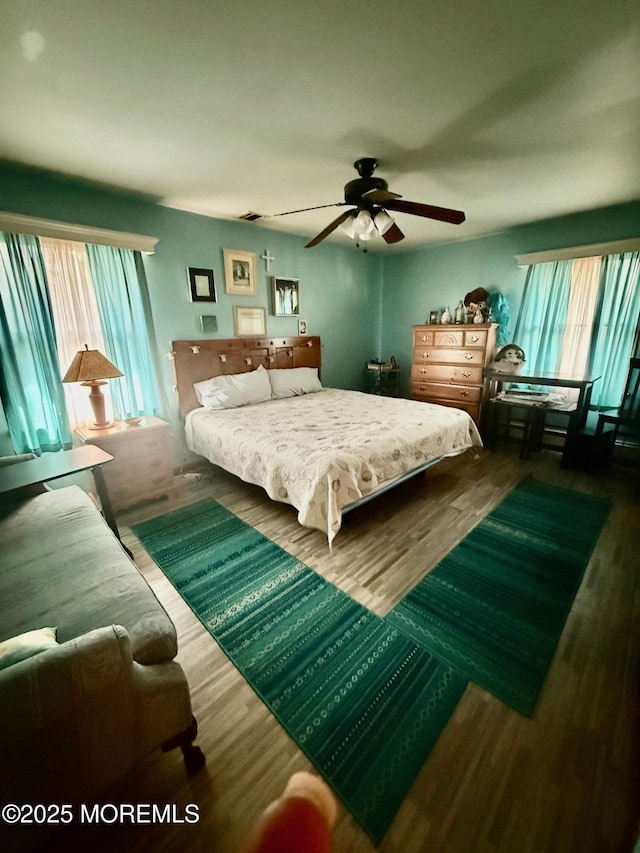 82 Bonita Rd, Waretown, NJ 08758 - bedroom featuring a ceiling fan, multiple windows, and wood finished floors