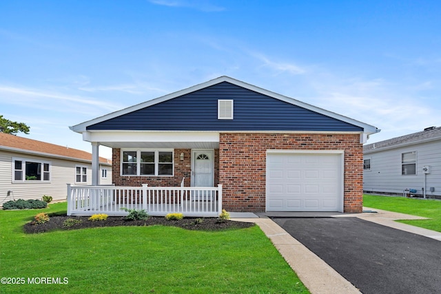 view of front of home with covered porch, brick siding, and a front yard