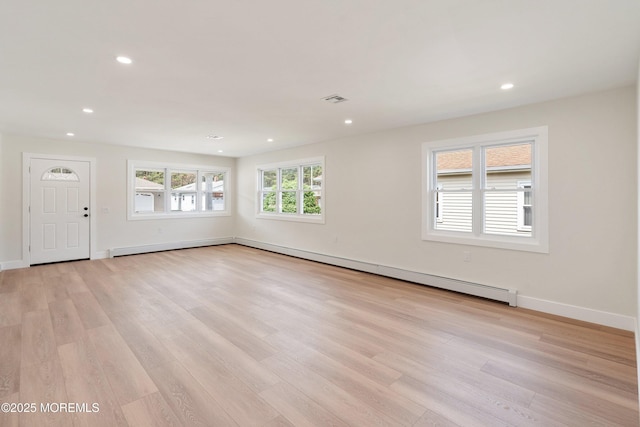 unfurnished living room featuring recessed lighting, baseboards, light wood-type flooring, and visible vents