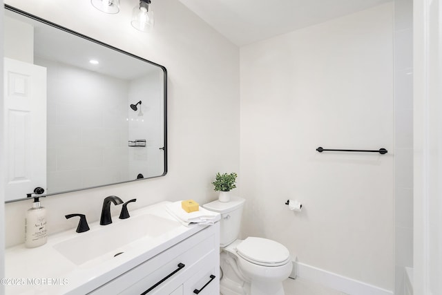 full bathroom with toilet, baseboards, walk in shower, and vanity