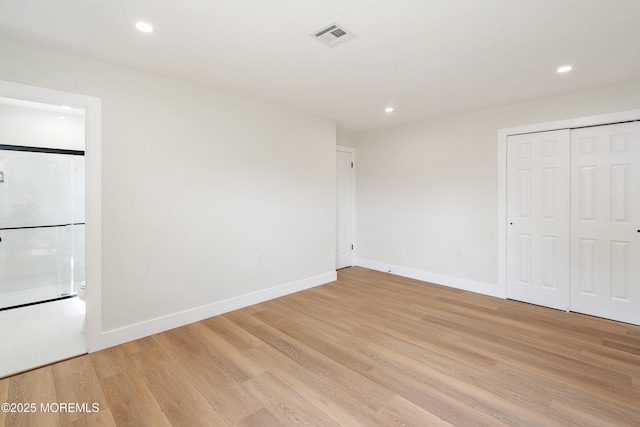 unfurnished bedroom featuring visible vents, recessed lighting, light wood finished floors, and baseboards