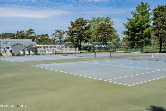view of sport court with fence