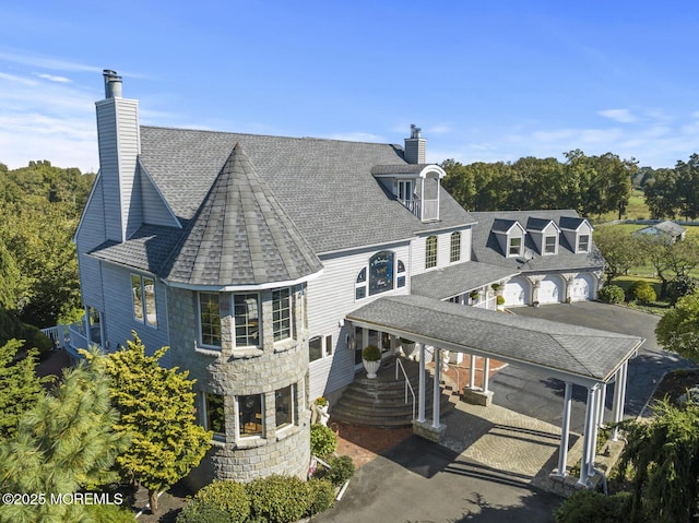 18 Schoolhouse Rd, Cream Ridge, NJ 08514 - view of front facade with roof with shingles, driveway, a chimney, and stone siding