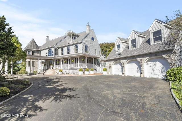 18 Schoolhouse Rd, Cream Ridge, NJ 08514 - view of front facade featuring a garage, covered porch, and driveway