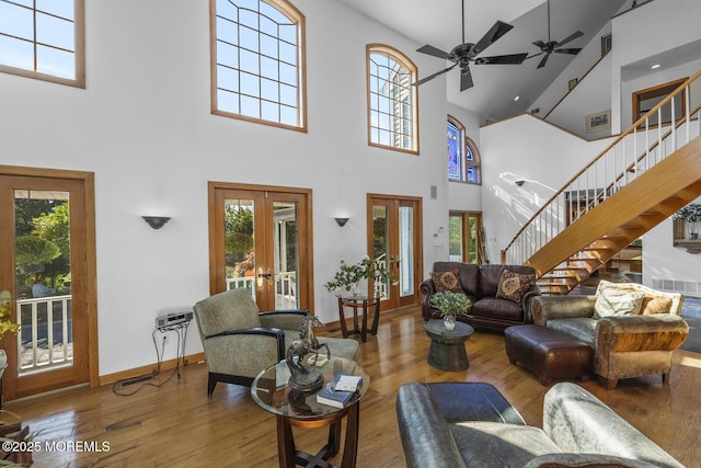 18 Schoolhouse Rd, Cream Ridge, NJ 08514 - living room with french doors, stairs, a towering ceiling, and hardwood / wood-style flooring