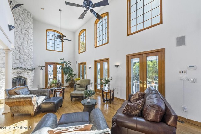 18 Schoolhouse Rd, Cream Ridge, NJ 08514 - living area with french doors, a ceiling fan, a high ceiling, and visible vents