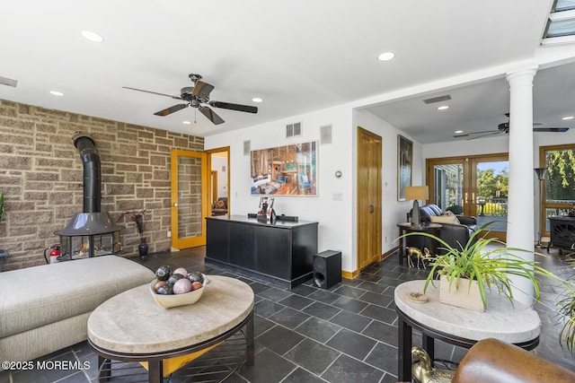 18 Schoolhouse Rd, Cream Ridge, NJ 08514 - living area featuring visible vents, a wood stove, baseboards, ceiling fan, and recessed lighting