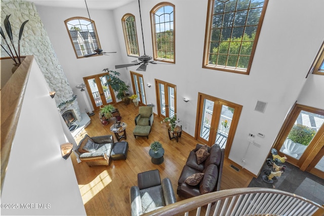 18 Schoolhouse Rd, Cream Ridge, NJ 08514 - living room featuring french doors, a ceiling fan, wood finished floors, a towering ceiling, and visible vents