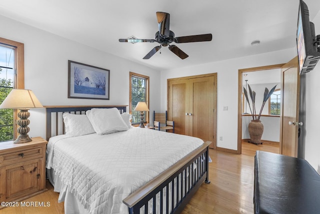 18 Schoolhouse Rd, Cream Ridge, NJ 08514 - bedroom with baseboards, ceiling fan, light wood-style flooring, and a closet