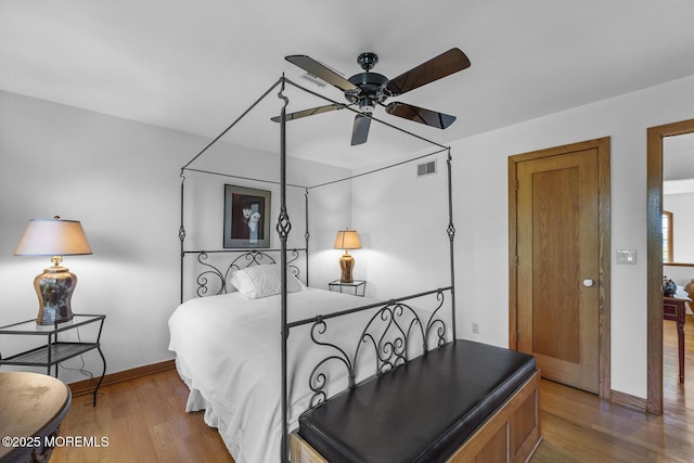 18 Schoolhouse Rd, Cream Ridge, NJ 08514 - bedroom with baseboards, visible vents, and wood finished floors