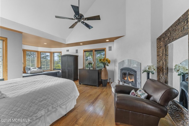 18 Schoolhouse Rd, Cream Ridge, NJ 08514 - bedroom with a glass covered fireplace, high vaulted ceiling, recessed lighting, and light wood finished floors